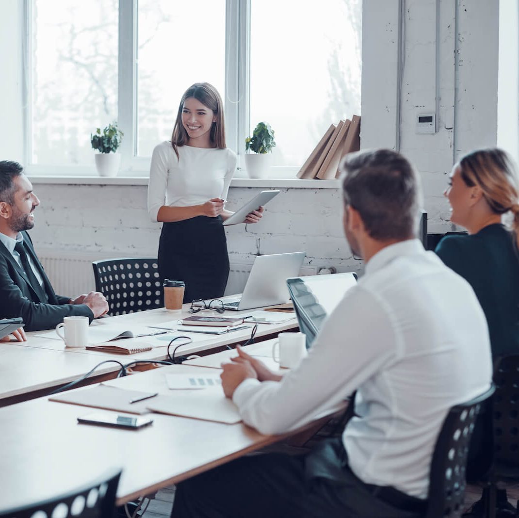 A business meeting led by a woman.